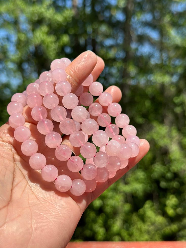 Bask in the gentle, loving energy of Rose Quartz, a crystal celebrated for its soft pink hue and nurturing properties. Known as the stone of unconditional love, Rose Quartz is perfect for enhancing emotional healing, fostering self-love, and inviting a deep sense of peace and compassion. Its calming vibrations help to soothe the heart, ease tension, and create a loving atmosphere. Keep Rose Quartz close to attract love, nurture your spirit, and fill your space with serene, positive energy. A timeless gem for those seeking to cultivate a heart full of warmth and tranquility. 🌸💖 Meditation Rose Quartz Crystal Bracelet With Natural Stones, Spiritual Rose Quartz Crystal Bracelet, Rose Quartz Beaded Bracelet Gift, Rose Quartz Round Crystal Bracelet Gift, Elegant Rose Quartz Crystal Bracelet For Meditation, Rose Quartz Gemstone Beads Bracelet For Meditation, Pink Rose Quartz Crystal Bracelet With Natural Stones, Pink Crystal Bracelet With Natural Rose Quartz, Pink Rose Quartz Bracelet For Meditation