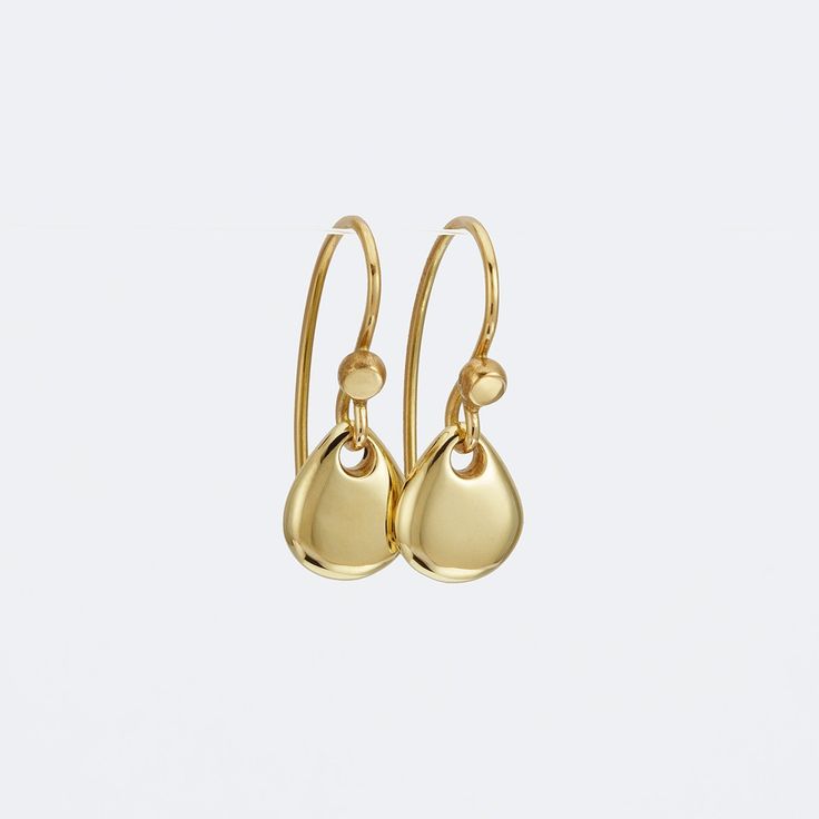 Classy and fine 14k gold dangle earrings, small yet eye catching. They are handmade of yellow 14k solid gold, and have a highly shiny finish. The smooth minimalist gold teardrops dangle and shine with every slight movement. These modern and feminine gold earrings are great to wear day or night, casual or dressy.  A wonderful gift for someone you love, and a treat for yourself. Total length of the earrings is 21 mm = approx. 0.8 inch Drop's height is 9 mm = approx. 0.35 inch Drop's width is 7.7 mm = approx. 0.30 inch Silicone ear backs are included for safety. * The earrings will be packed in a gift box ready to give as a gift, and shipped via Express mail service which usually takes 4-6 business days to arrive. * For more gold earrings click here: http://www.etsy.com/shop/SigalGerson?secti Modern Gold Teardrop Earrings In 14k Gold, Minimalist Gold Drop Earrings With Matching Set, Modern Gold Briolette Earrings, Minimalist Yellow Gold Drop Earrings, Modern Long Drop Yellow Gold Earrings, Gold Hypoallergenic Briolette Earrings, Hypoallergenic Gold Briolette Earrings, Minimalist Hypoallergenic Briolette Earrings, Minimalist Briolette Hypoallergenic Earrings