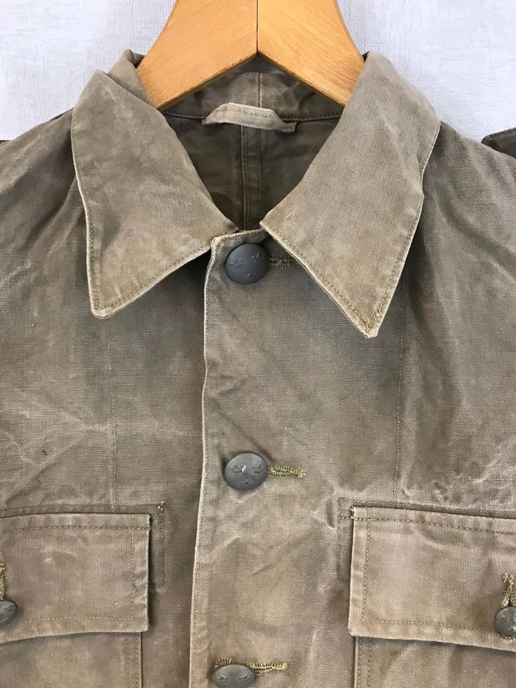 "Vintage Stone Canvas Chore Worker Jacket - 100% Cotton Tough Faded Military - S M L XL Rugged tailored military design in a stunning faded stone wash grey/desert brown canvas fabric that makes the perfect midweight jacket. Metal buttons, two front pockets and epaulettes to shoulders. Most will not be decorated but there may be a few with badges to collar or chest which can be easily removed if desired. - Original Swedish tagging within - Unlined - Dated 1950s-60s - Made from thick, durable cott Vintage Khaki Outerwear With Patch Pockets, Military Style Collared Utility Jacket, Military Style Collared Utility Jacket Single Breasted, Military Style Single Breasted Collared Utility Jacket, Vintage Khaki Sport Coat For Work, Military Style Single-breasted Collared Utility Jacket, Vintage Khaki Single-breasted Sport Coat, Vintage Single-breasted Khaki Sport Coat, Vintage Cotton Button-up Sport Coat