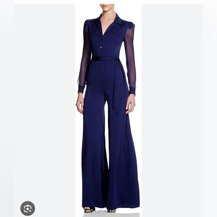 This Piece Has Long Cuffed Sleeves, A V-Neckline That Can Can Buttoned Up, A Fitted Bodice, And A Matching, Waist-Cinching Tie. I Am 5’2 And I Wore It With 4 Inch Heels So It Can Fit Someone 5’7-5’9 Additionally There Is Extra Hem At The Bottom, 2 Inches If You Want To Take The Pants Off Seem Out And Make Them Longer. Fitted Blue Pantsuit For Evening, Formal Fitted Blue Jumpsuits And Rompers, Blue Fitted Pantsuit For Evening, Elegant Fitted Blue Jumpsuits And Rompers, Elegant Blue Pantsuit For Party, Blue Long Sleeve Jumpsuit For Formal Occasions, Chic Blue Party Pantsuit, Chic Blue V-neck Pantsuit, Non-stretch Denim Blue Long Sleeve Jumpsuit