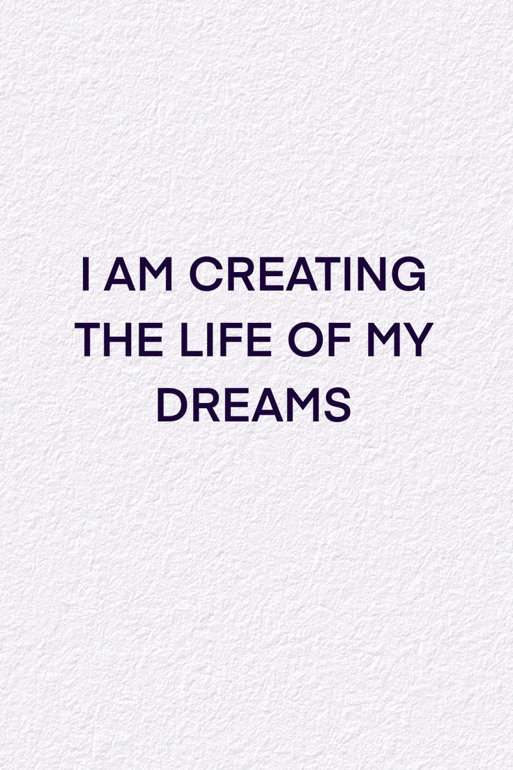 the words i am creating the life of my dreams written in black on a white background