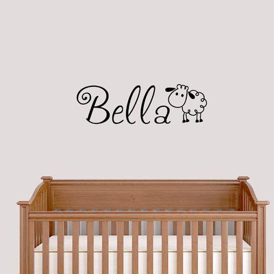 a baby crib with a wall decal that says,'bella '