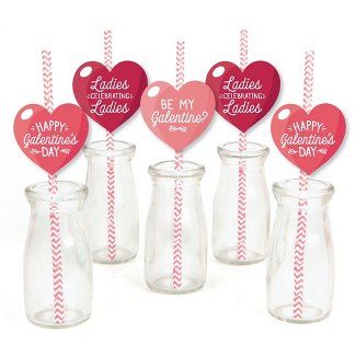 six valentine's day straws in glass jars with red and white striped paper