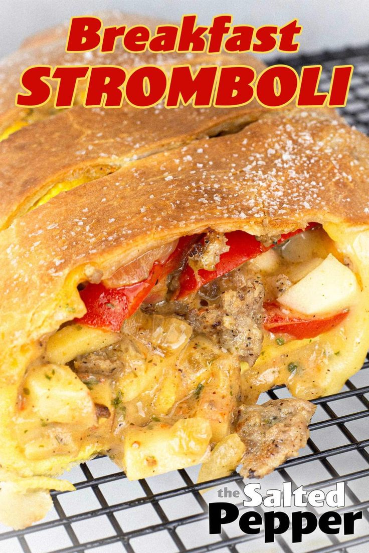 the breakfast stromboli is cut in half and ready to be eaten