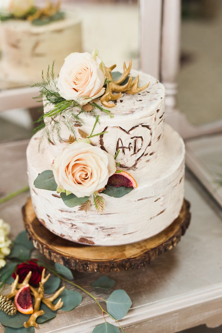 a wedding cake with white frosting and flowers