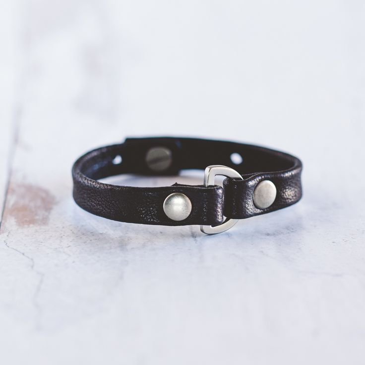 Our Do Good Bracelet is handcrafted with the softest lamb leather and detailed with a rounded D-ring and large flat rivets. This bracelet can be worn alone or stacked with your favorite Giving Bracelet! FEATURES Handcrafted - Each Bracelet is delicately handcrafted. Finest Leather Available - We use lamb leather to achieve a much softer feel than cow leather. Makes The World a Better Place - The heart of our business is giving back and we are honored to be partnered with Voices for CASA Children Adjustable Leather Wristband For Everyday, Classic Adjustable Leather Bracelet, Classic Adjustable Leather Bracelet With Wrist Strap, Adjustable Leather Wristlet With Wrist Strap, Adjustable Leather Bracelet With Snap Closure, Adjustable Classic Bracelet, Adjustable Cuff Leather Bracelet For Everyday, Adjustable Leather Cuff Bracelet For Everyday, Everyday Leather Bracelet With Wrist Strap