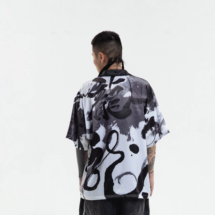 Experience the perfect fusion of street style and casual comfort with our Dragon Calligraphy Cuban Half Shirt. This shirt features an all-over print of calligraphy artwork, exuding a unique and edgy street vibe. The addition of ink splatter prints adds depth and character to the design. A single pocket adorns the left chest, offering both style and functionality. With half sleeves and a Cuban collar, this shirt strikes the perfect balance between modern and retro aesthetics. Crafted from premium Dragon Calligraphy, Half Shirt, Calligraphy Artwork, Ink Splatter, Half Shirts, Brand Sale, Accessories Branding, Sale Design, Half Sleeves