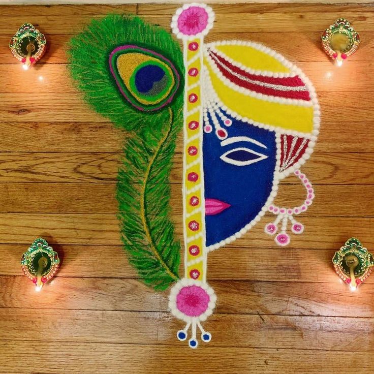 an artisticly decorated peacock face on a wooden floor