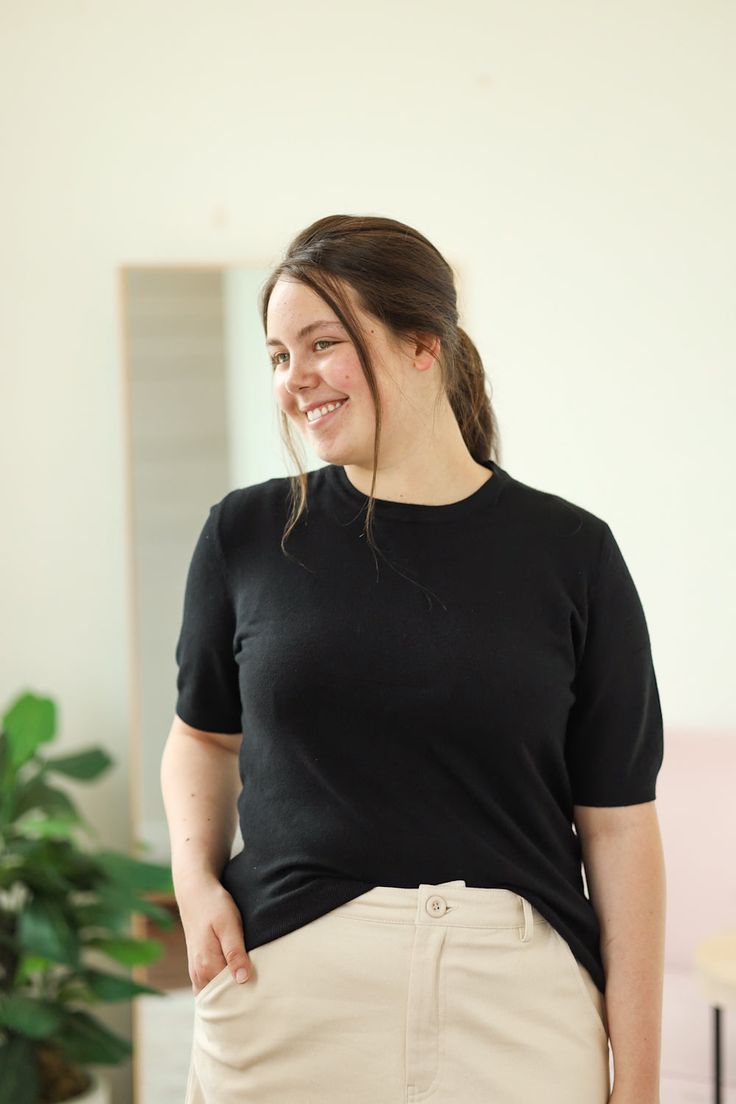 Our Lundy Top is such a great top to add to your wardrobe. This soft knit top is perfect for wearing alone or layering under a shirt or shacket! - Crew neck - Short sleeve - Soft knit - Material: 100% Viscose - Model is 5’7" & wears a small. She is wearing a small in the cream top. - Model is 5’6" & wears a M/L. She is wearing a large in the black top. Color Disclaimer: Actual colors may vary due to computer monitors. *Measurements are taken flat, and then doubled.* Size Bust Length Sleeve Small Stretch T-shirt For Workwear In Fall, Fall Layering Blouse With Crew Neck, Fall T-shirt With Ribbed Neckline For Everyday, Fall T-shirt With Ribbed Neckline, Versatile Crew Neck Fall Blouse, Fall Crew Neck Versatile Blouse, Versatile Crew Neck Tops For Fall, Effortless Black Relaxed Fit Tops, Solid Knit Tops For Layering