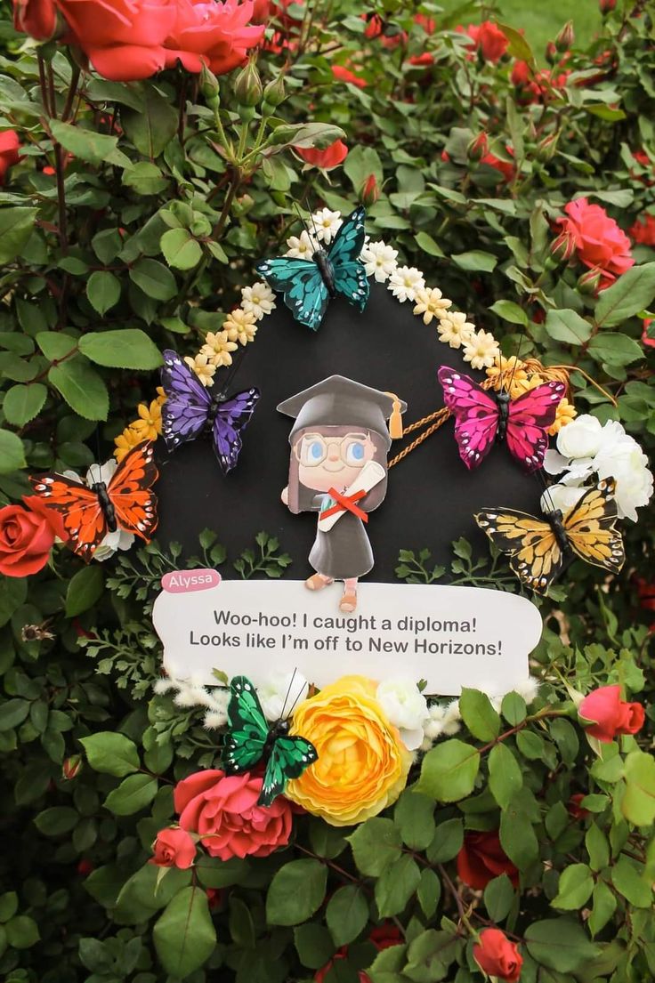 there is a plaque in the bushes with flowers and butterflies around it that says work - school taught a diploma