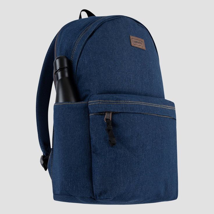 This Levi's backpack is signature style designed with everyday function in mind. It's made of durable denim containing sustainably sourced cotton and lined with lightweight poly to reinforce the integrity of the bag. The zippered main compartment is spacious enough to hold what you need for the day and the zippered back compartment is padded, and can be used to hold your laptop or tablet. Use the bottle pocket on the side to hold your beverage and the zippered pocket on the front to help secure Casual Denim Blue Backpack For Daily Use, Casual Canvas Backpack With Zipper Pocket, Casual Denim Blue Standard Backpack, Denim Blue Standard Backpack With Zipper, Denim Blue Backpack With Pockets For Everyday Use, Denim Blue Backpack For Travel, Denim Blue Travel Backpack With Zipper Closure, Denim Blue Backpack For Everyday And Back To School, Denim Blue Travel Backpack With Zipper