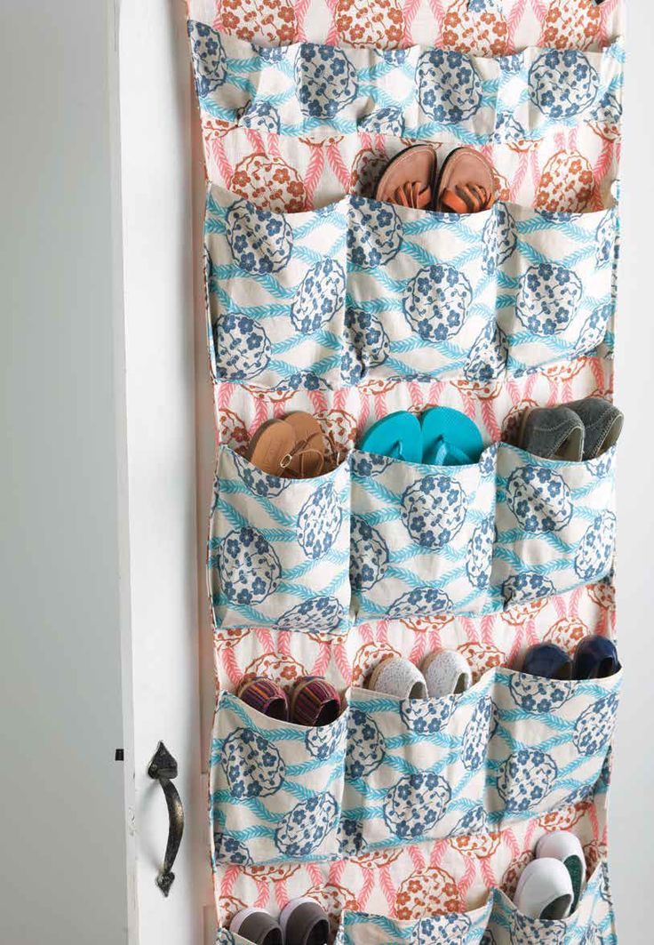 an over the door shoe rack with several pairs of shoes hanging on it