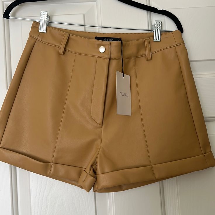 Camel Color, Cuffed Faux Leather Shorts. 13” Long, Never Worn. Perfect Condition, Purchased At Vici Brown Faux Leather Bottoms For Spring, Brown Leather Short Bottoms, Brown Leather Summer Bottoms, Brown Faux Leather Shorts For Night Out, Brown Faux Leather Short Bottoms, Chic Brown Shorts With Belt Loops, Summer Brown Faux Leather Bottoms, Trendy Brown Shorts For Workwear, Trendy Brown Shorts For Night Out