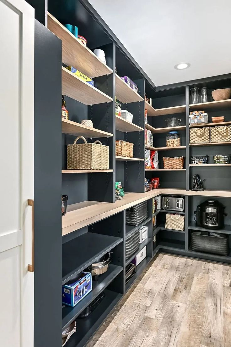 a large walk in pantry with lots of shelves