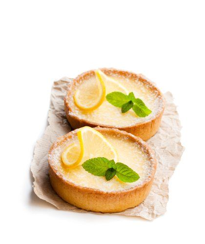 two pies with lemon slices and mint leaves