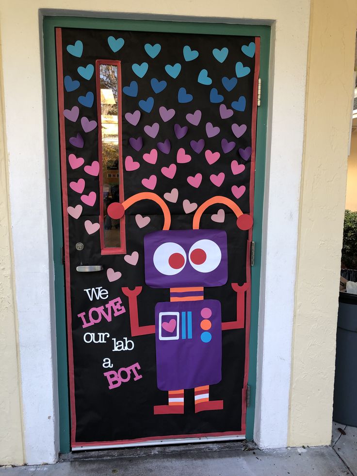 a door decorated with hearts and an image of a robot holding a heart on it