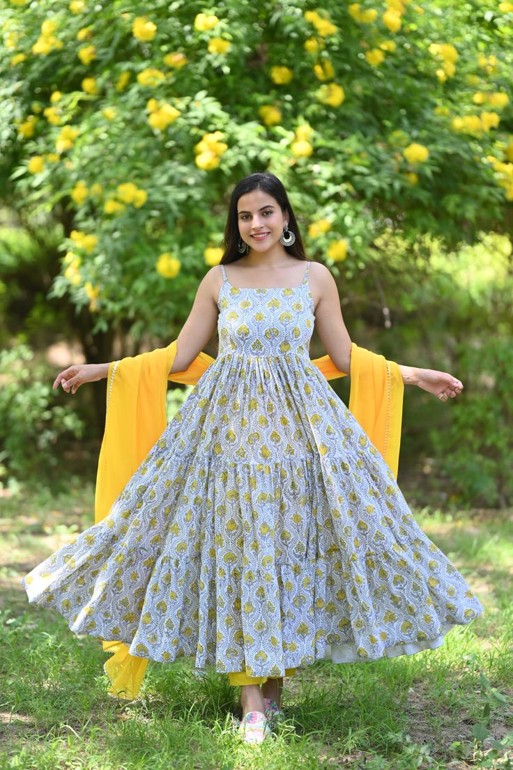 PRODUCT DESCRIPTION :-Look gorgeous this season in our Off white hand block Anarkali set. With an eye - catchy floral print , it will definitely bloom joyful flowers in your heart.Anarkali :- Handblock Printed CottonPant :- CottonDupatta :- ChiffoneColor:- Anarkali and Pant - Off white Dupatta - YellowCare Instructions :- Dry clean onlyModel Size :- Model is wearing XS sizeModel Height :- 5.6''DISCLAIMER :- Slight color variations may occur due to different screen resolution. White Anarkali Set With Printed Motifs, Sleeveless White Kurta For Diwali, Festive White Anarkali Set With Printed Motifs, Bohemian White Anarkali Set With Printed Motifs, White Mulmul Anarkali Set With Printed Motifs, Festive White Maxi Length Anarkali Set, Anarkali Salwar Kameez With Printed Motifs In White, Yellow Anarkali Set With Floral Print Straight Kurta, Yellow Floral Print Anarkali Set With Straight Kurta