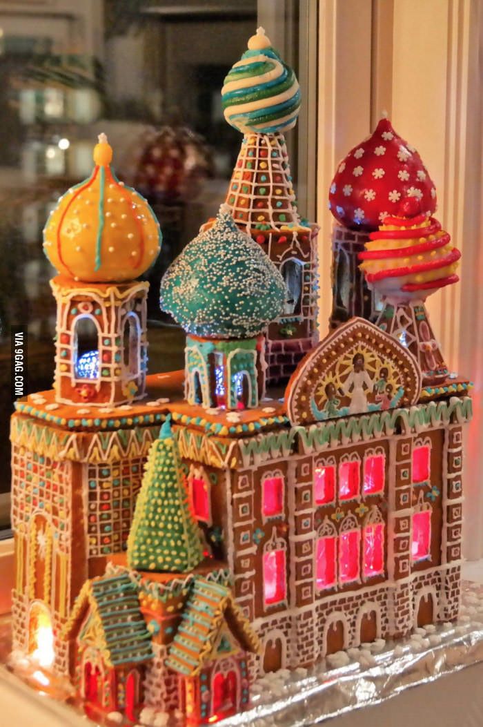 an elaborately decorated gingerbread castle in front of a window