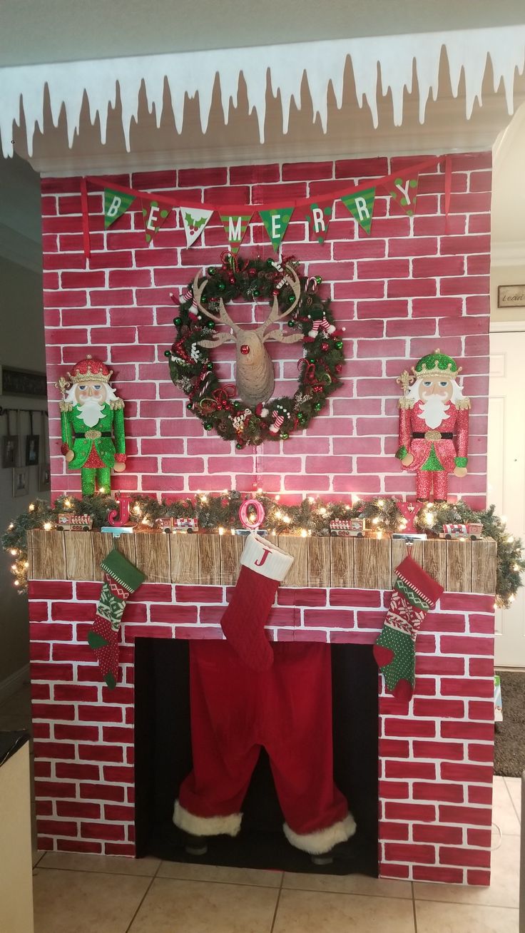 a fireplace decorated for christmas with stockings and stocking