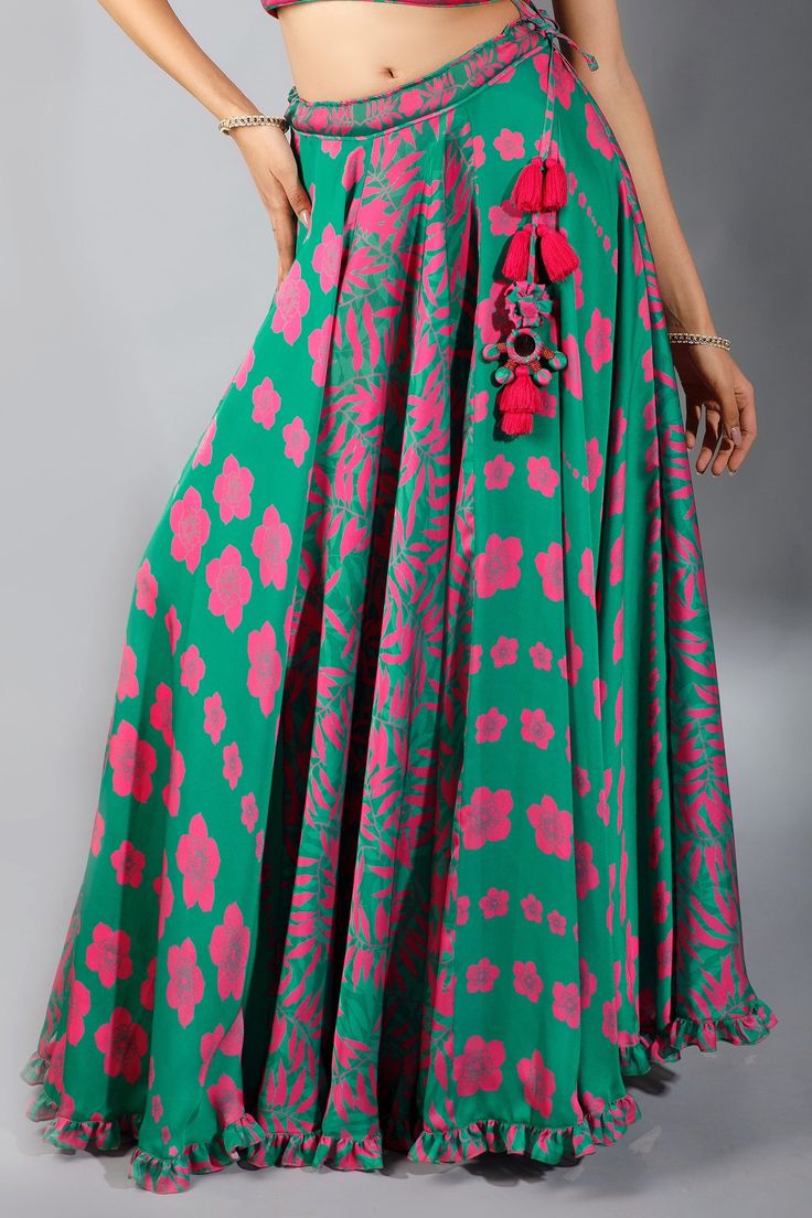 Jade green lehenga with all-over floral print, drawstring with tassels and ruffle hem. Comes with french rose halter blouse and dupatta.
Components:3
Printed
Neckline:Halter
Sleeve Length:Sleeveless
Fabric:Silk, Pleated Satin
Color:Green
Pleated blouse with tie-up at the back
Printed dupatta with tassels - Aza Fashions Printed Lehenga, Halter Blouse, Green Lehenga, Printed Dupatta, French Rose, Pleated Blouse, Satin Color, Silk Embroidery, Fabric Silk