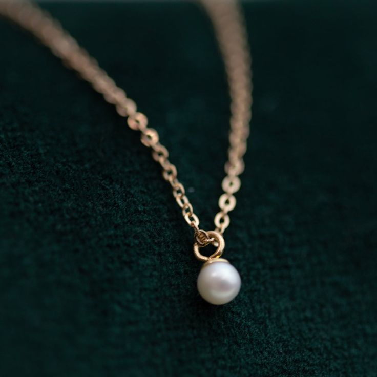 This Mini Pearl Pendant Necklace is the perfect complement for your evening wear or casual wardrobe. Crafted from 14k gold, this delicate necklace features a small cultured pearl, lending it a minimalist and elegant look. With this classic and versatile accessory, you're sure to make a statement. Pearl size: 2.75-3mm 1 Classic Pearl Necklace With Delicate Chain, Minimalist 14k Gold Necklace With Pearl Pendant, Elegant Rose Gold Pearl Necklace With Delicate Chain, Dainty 14k Gold Pearl Necklace, Classic Rose Gold Pearl Necklace, Minimalist 14k Gold Pearl Necklace With Pearl Charm, Elegant Everyday Pearl Pendant Necklace, Minimalist 14k Gold Pearl Necklace Gift, Delicate 14k Gold Pearl Necklace With Delicate Chain