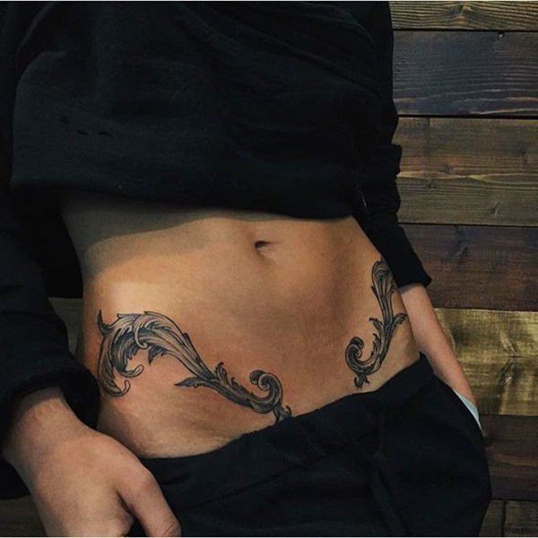 a woman with a tattoo on her stomach