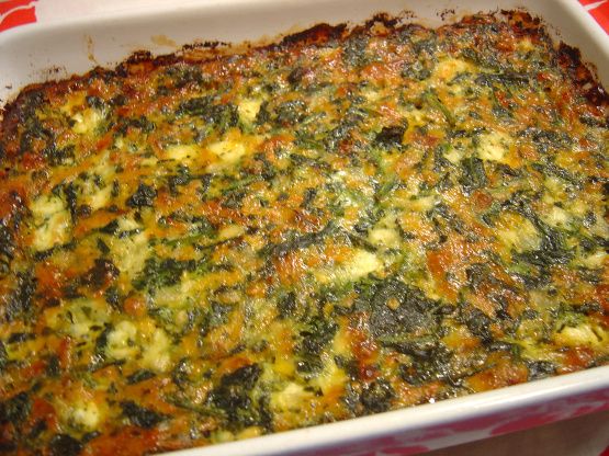 a casserole dish with broccoli and cheese in it on a table