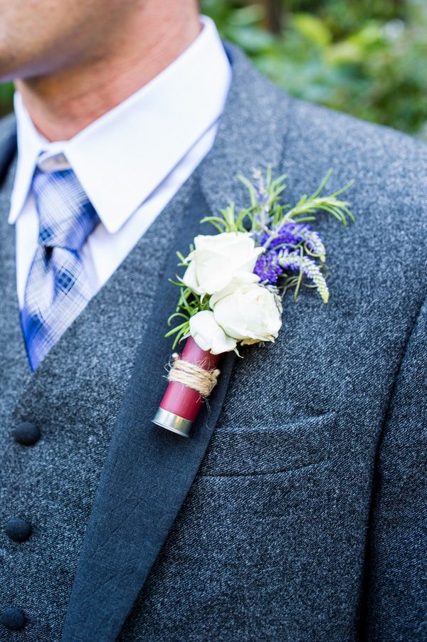 a man in a suit with a boutonniere on his lapel