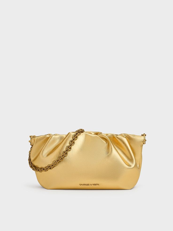 Make a splash at your next party with this Brigette clutch. Soft, ruched folds add movement to the gilded gold-tone finish to give it a distinctive look. Secured by frame closure, the bag opens up easily while still keeping your valuables secure. Carry it on the shoulder with the matching gold-tone chain for a glamorous look, or carry it in hand as a clutch. Alternatively, the adjustable strap can help tone down the bag for casual use. Glamorous Look, Charles Keith, Gold Gilding, Gold Tones, Adjustable Straps, Chain, Frame, Gold