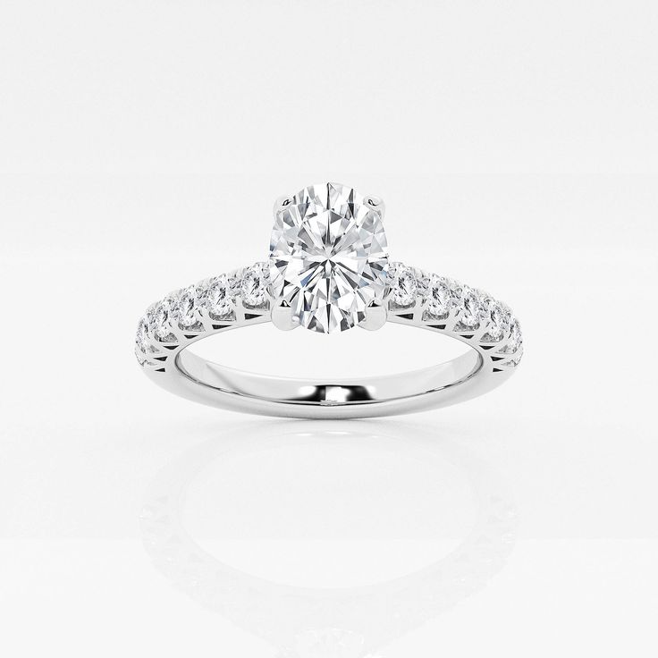 a diamond engagement ring on a white background