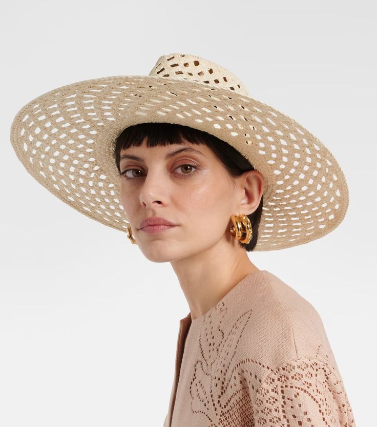 Leather-trimmed raffia sun hat in beige - Valentino | Mytheresa Chic Cream Panama Hat In Toquilla Straw, Summer Flat Brim Open Weave Hat, Chic Spring Boater Hat Made Of Paper Straw, Chic Natural Straw Hat With Upf 50+, Cream Toquilla Straw Hat For Vacation, Elegant Beige Panama Hat With Upf 50+, Spring Straw Hat With Open Weave And Flat Brim, Summer Hats With Open Weave And Flat Brim, Spring Straw Sun Hat With Open Weave