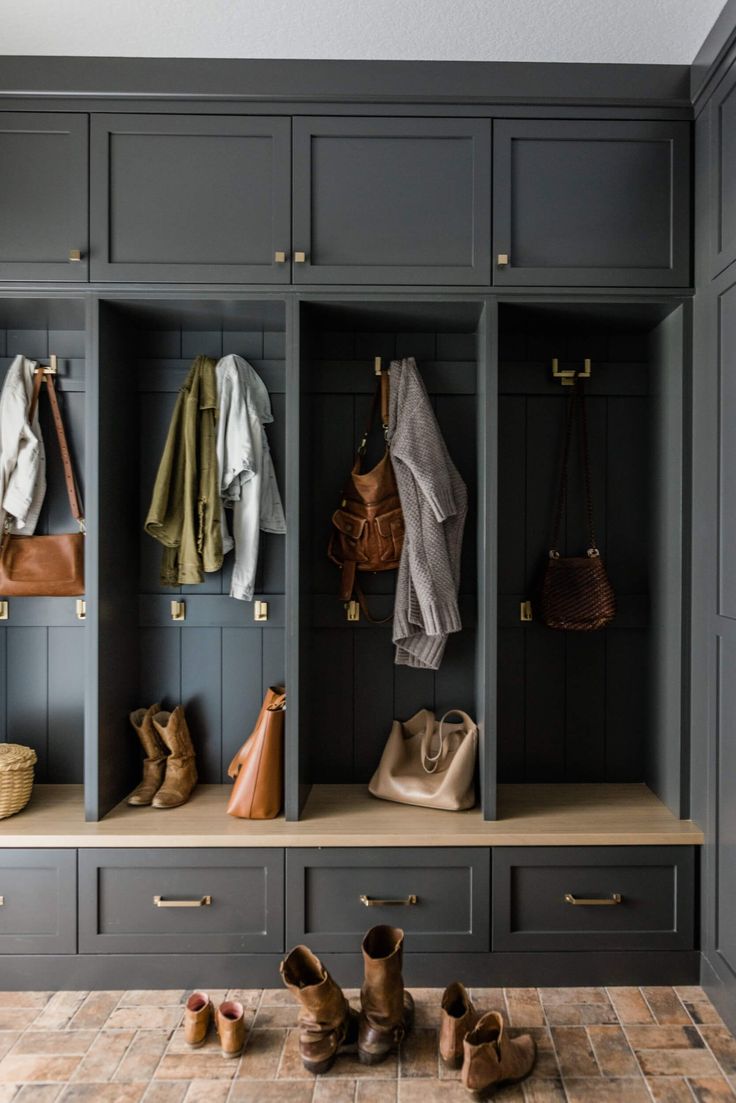 an organized mud room with shoes and purses