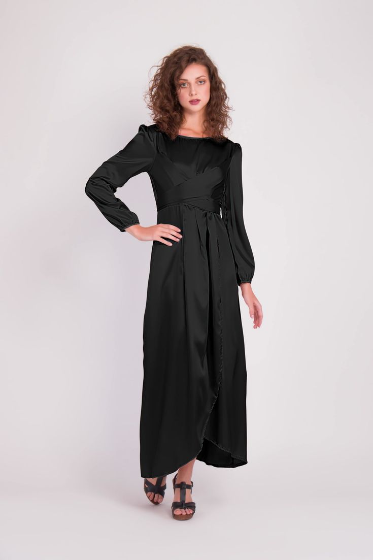 Feel more confident than ever before in the Satin Wrap Maxi Dress with Puff Sleeves that combines modesty with today’s most current modest fashion trends. The sleek satin maxi dress accentuates the waist with a luxurious wrap design while the puff sleeves accent a bold shoulder and feminine shape. Perfect for every special occasion, the unique dress comes in multiple colors to best fit your individual personality. Long Sleeve Maxi Dress With Side Slits, Evening Floor-length Maxi Dress With Tie Waist, Belted Floor-length Party Dress, Evening Dress With Belted Cuffs And Long Sleeves, Floor-length Belted Party Dress, Fitted Maxi Dress With Belted Cuffs, Fitted Maxi Dress With Tie Waist, Evening Maxi Dress With Tie Waist, Modest Floor-length Maxi Dress For Evening