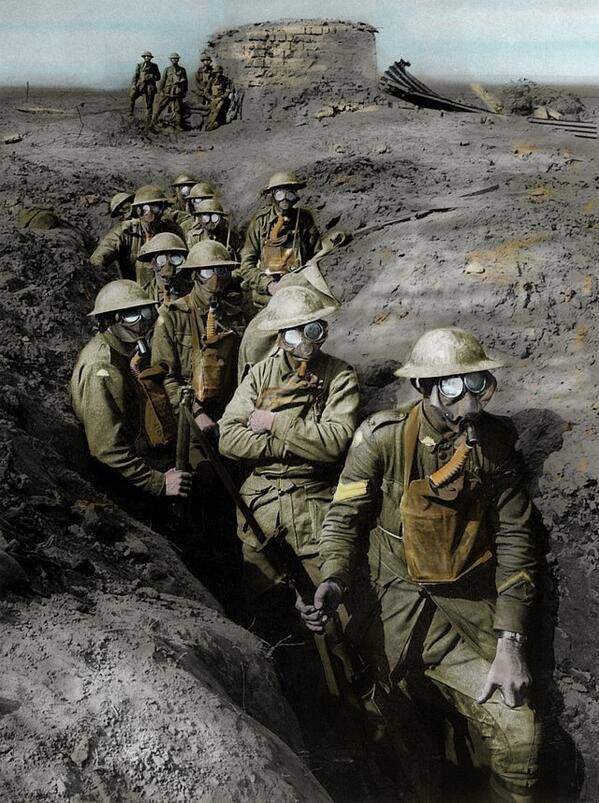 some soldiers are going up a hill in the desert with their helmets and goggles on