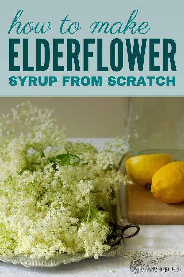 elderflower syrup from scratch on a cutting board with lemons in the background and text overlay that reads how to make elderflower syrup from scratch