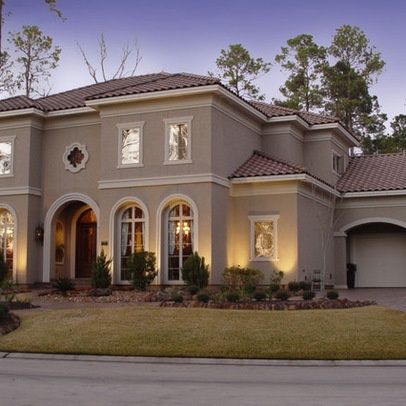 a large house is lit up at night