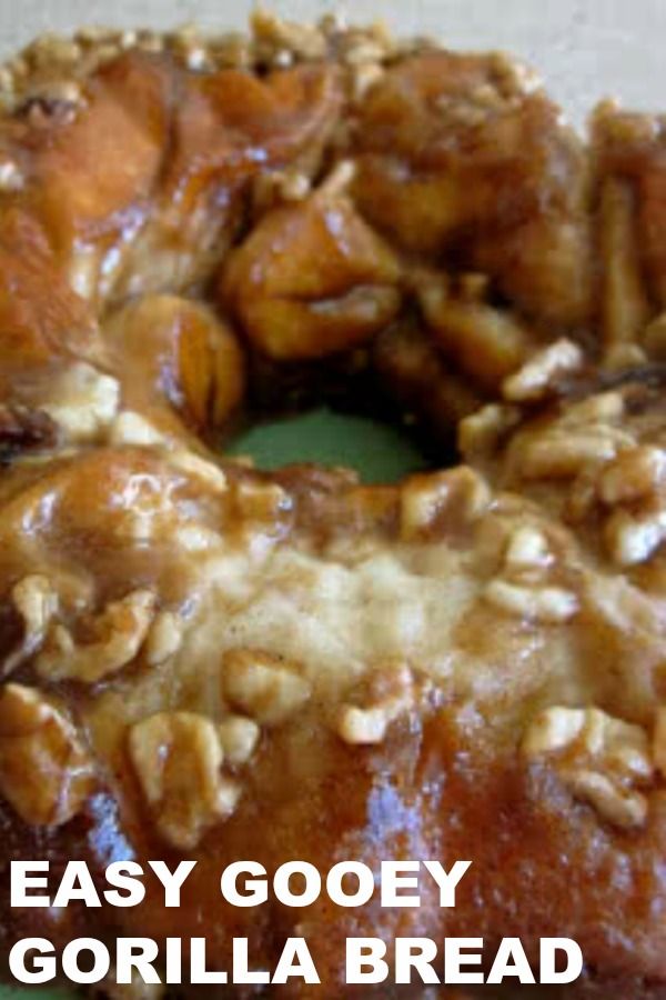 a close up of a doughnut with nuts on it and the words easy gooey gorilla bread