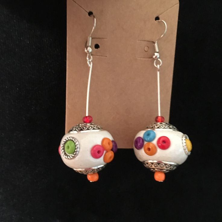 New For Boutique. White Bead Earrings With Delicate Silver Engraved Swirls On Top & Bottom Bead Caps & Bright Orange, Red, Turquoise, Lime, & Purple Beads Sprinkled Around The Bead. Single Bead Hanging On Silver Wires For Pierced Ears. When Items Are Listed For $25, Please No Cheapo Offers At All. I Won’t Consider Them, I Only Get $20 From That Sale. And I Will Have Given You Something Worth Way More Than You Paid. White Beaded Round Earrings For Gift, White Round Beaded Earrings For Gift, White Round Beaded Earrings As Gift, Nickel-free White Beaded Round Earrings, Nickel-free White Round Beaded Earrings, White Handmade Adjustable Earrings, White Nickel-free Round Beaded Earrings, Traditional White Earrings With Ear Wire, Nickel Free White Bohemian Earrings