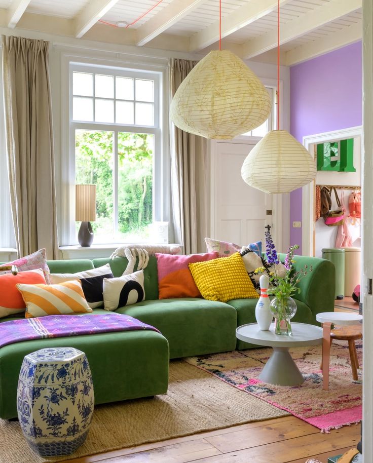 a living room filled with lots of colorful furniture