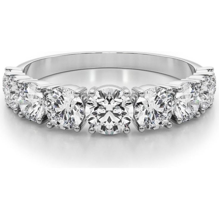 a four stone diamond ring on a white background