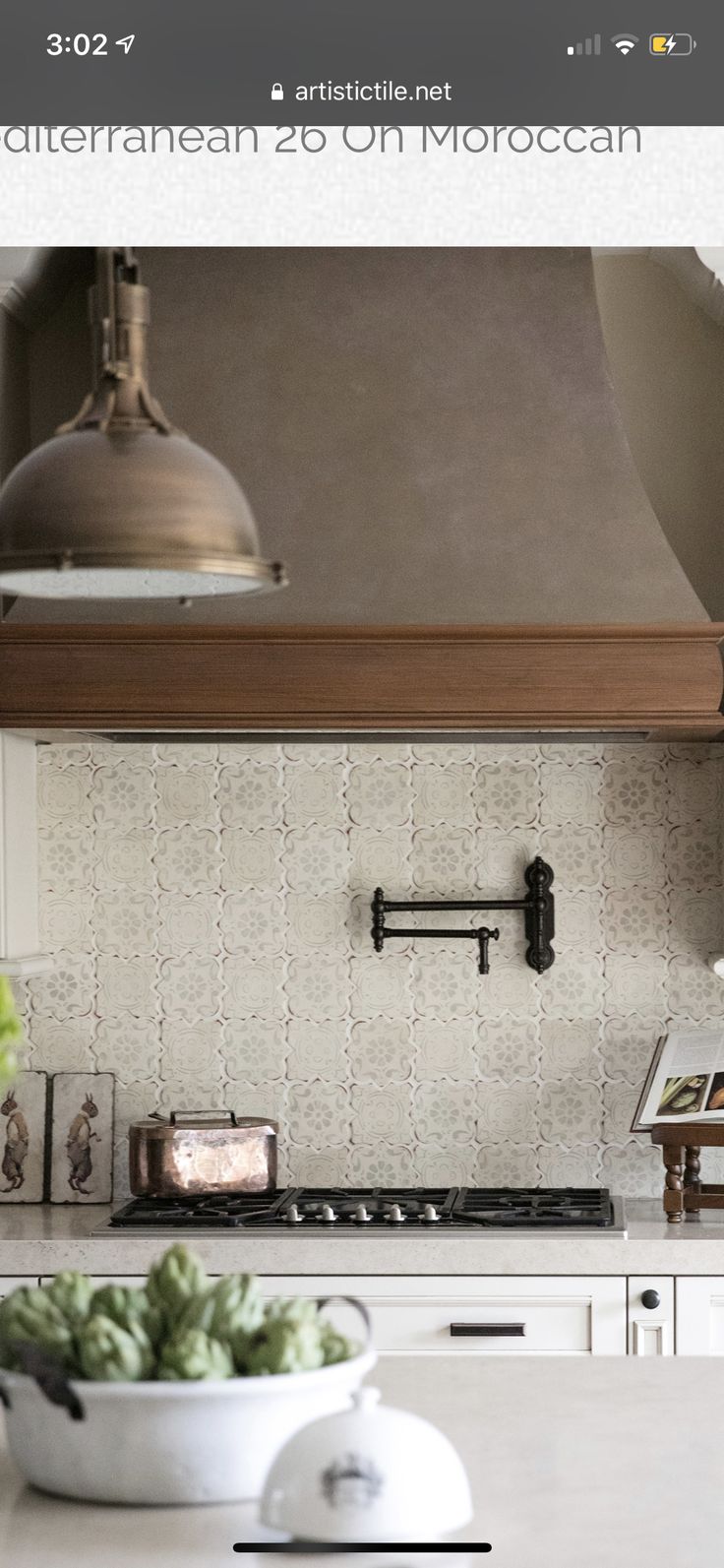 an image of a kitchen with white counter tops and cabinets in the background, including a bowl of lettuce