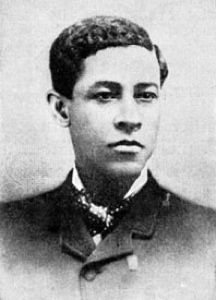 an old black and white photo of a young man