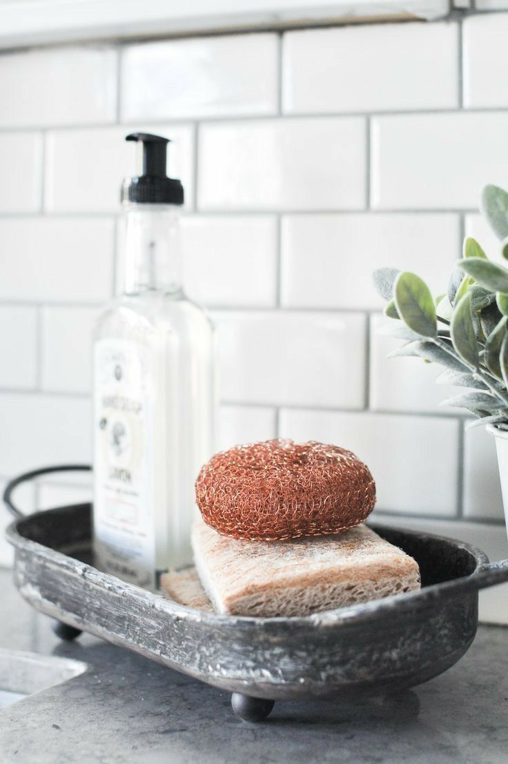 a loaf of bread sitting on top of a pan next to a potted plant