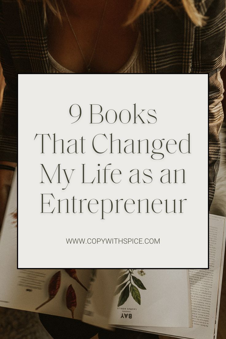 a woman holding an open book with the title 9 books that changed my life as an entrepreneur