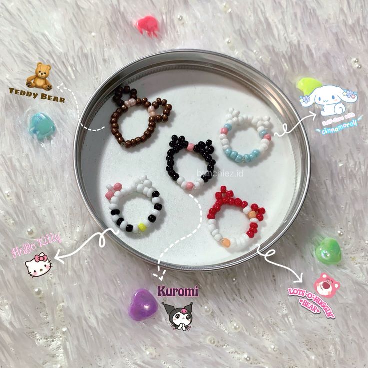 an assortment of bracelets are displayed on a tray