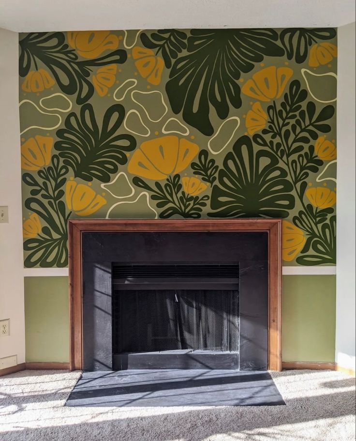 an empty fireplace in a room with green and yellow wallpaper