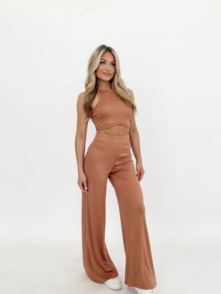 Wrap yourself in luxury and style with the Malibu Muse Pant. Soft, stretchy knit fabric offers all-day comfort and convenience for lounging, errands, and more. Featuring a high-waisted, wide leg design with a stretchy, elastic waistband for a perfect fit. A pop of color and ribbed texture add a fun, elevated finish that's perfect for any look. Versatile and trendy, the Malibu Muse Pants are ready for anything. * Malibu Muse Top sold separately 88% Polyester 12% Spandex Hand wash cold. Merchandising Tips, Ribbed Texture, Leg Design, Dresses Xs, Muse, Jumpsuit Romper, Knit Fabric, Color Pop, That Look