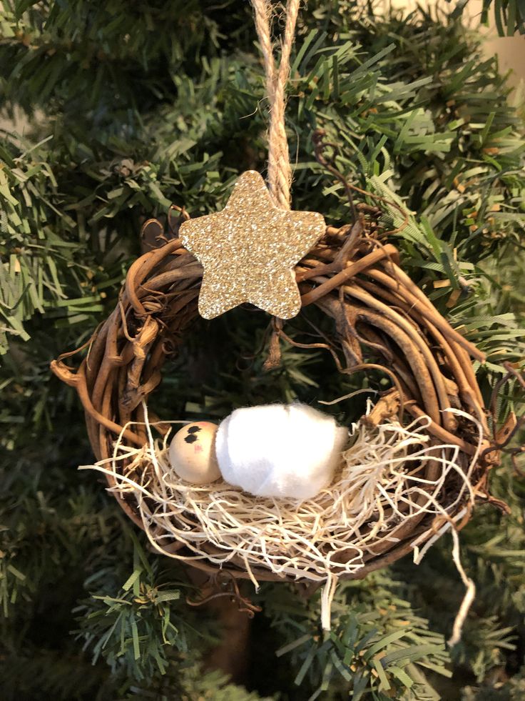 a christmas ornament with a star hanging from it's side on a tree