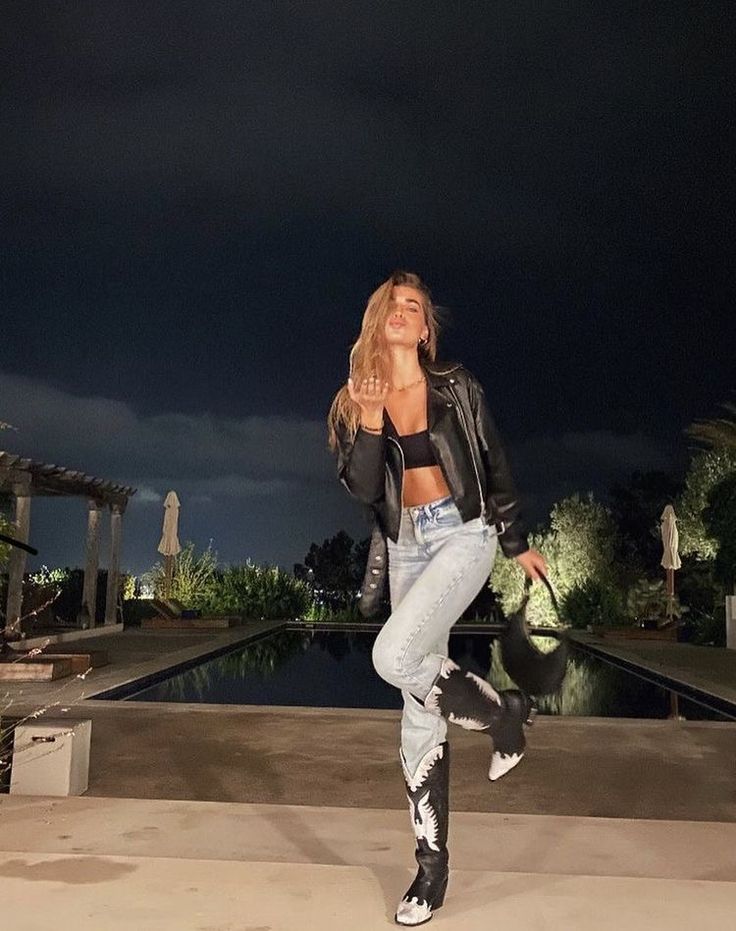 Hailey Bieber Cowgirl, Black Band T Shirt Outfit, Black Cowgirl Boot Outfit Fall, Western Outfits Women With Boots, Black Jeans Country Concert Outfit, Black And White Cowgirl Boots Outfit, Sweatshirt And Cowboy Boots Outfit, Cowboy Boot Going Out Outfit, How To Style Silver Cowboy Boots