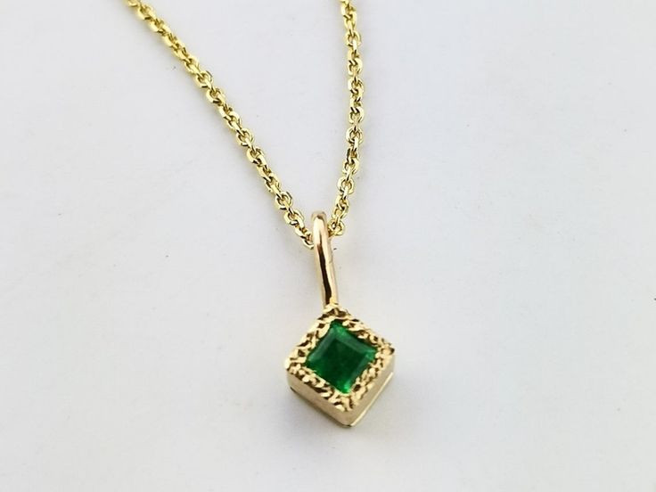 Enchant her this Christmas with memorable gift of this gold emerald necklace. It is made by hands in my little workshop in solid 14k gold. The stone is natural, coming from Earth- not synthetic or lab created. This necklace is in minimalistic style so the woman who loves delicate jewelry is bound to fall in love with it:) The stone is vivid, full of life, beautiful green. It matches perfectly with the square emerald ring from minimalistic collection and square emerald earrings. If you are lookin 14k Gold Emerald Pendant Necklace, Yellow Gold Emerald Necklace As Gift, Fine Yellow Gold Emerald Necklace As Gift, Gold Emerald Necklace As Gift, Gold Emerald Necklace In 14k As A Gift, Gold Emerald Necklace In 14k Gold As Gift, Yellow Gold Emerald Necklaces As A Gift, 14k Gold Emerald Necklace For A Gift, Green Diamond-cut 14k Gold Necklace